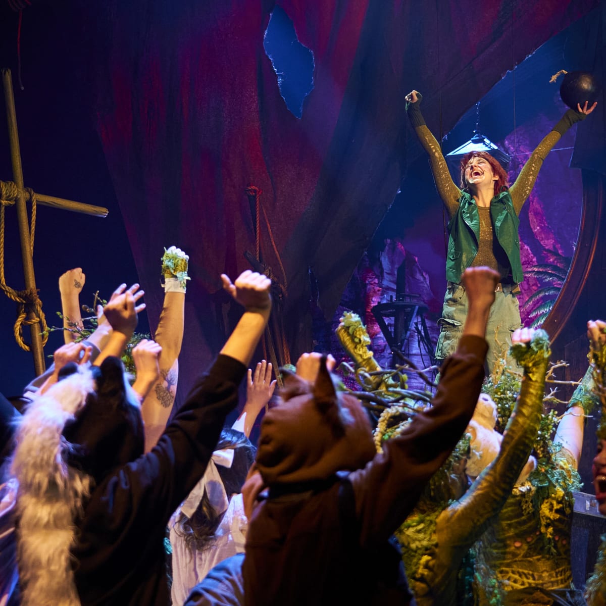 Peter Pan as a leader in front of a group.