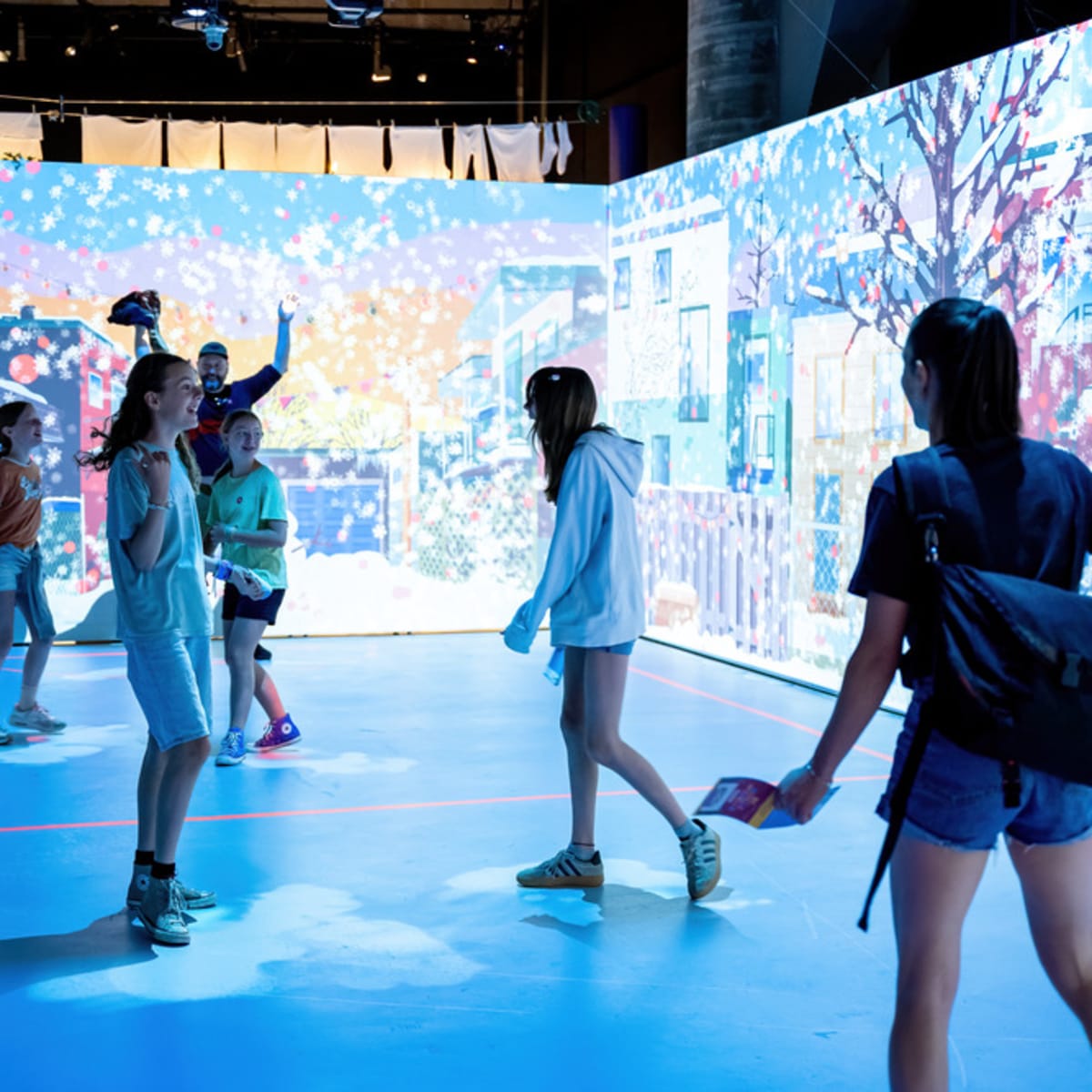 Children and teens in an interactive room. 