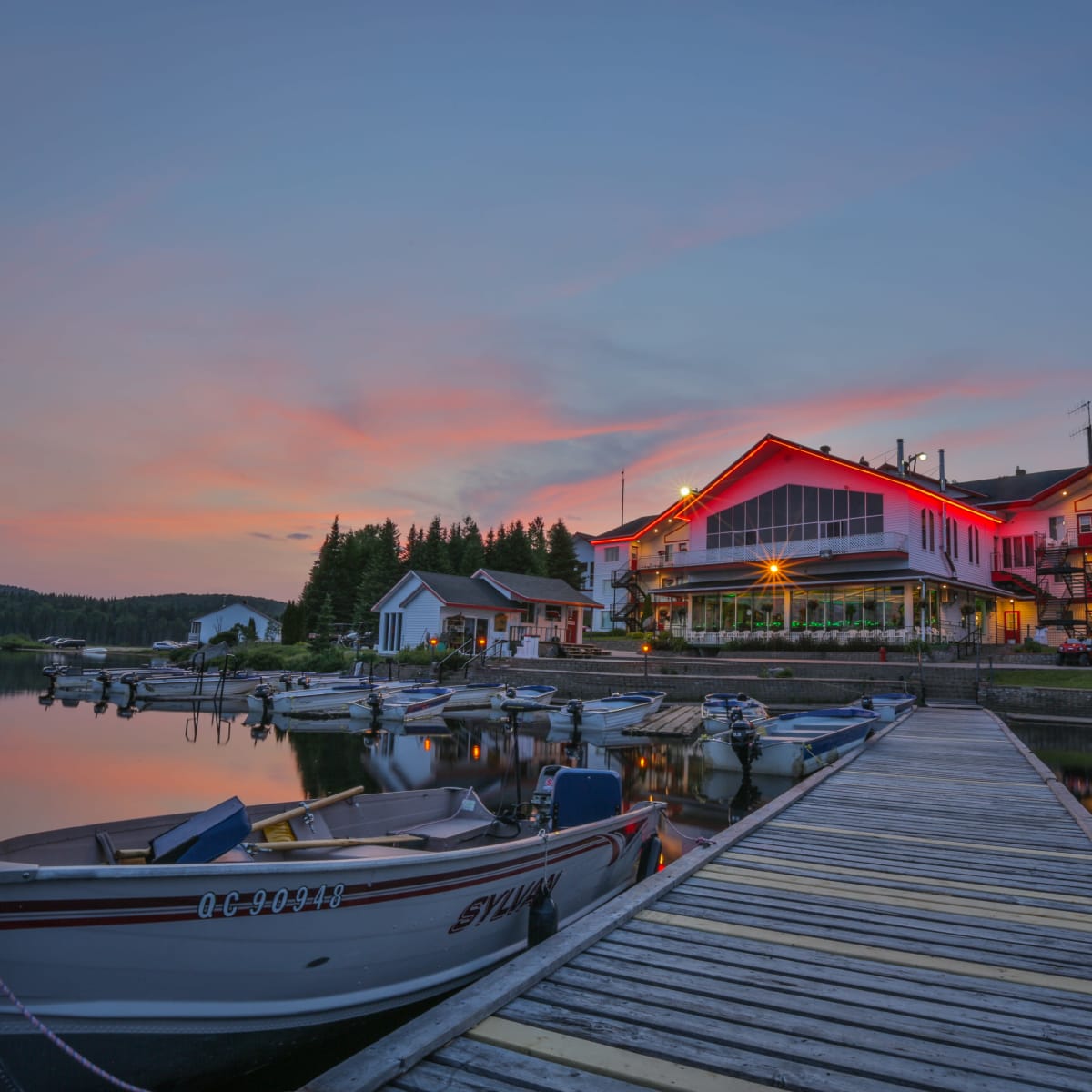 Lake and bulding at night.
