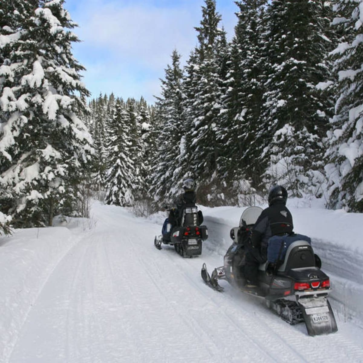 Snowmobiling at Michel St-Louis Outfitters in winter.