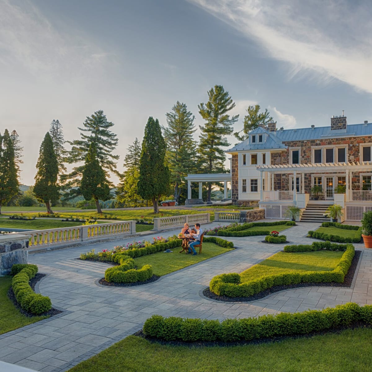 Couple sitting in the garden of StoneHaven the Manor.