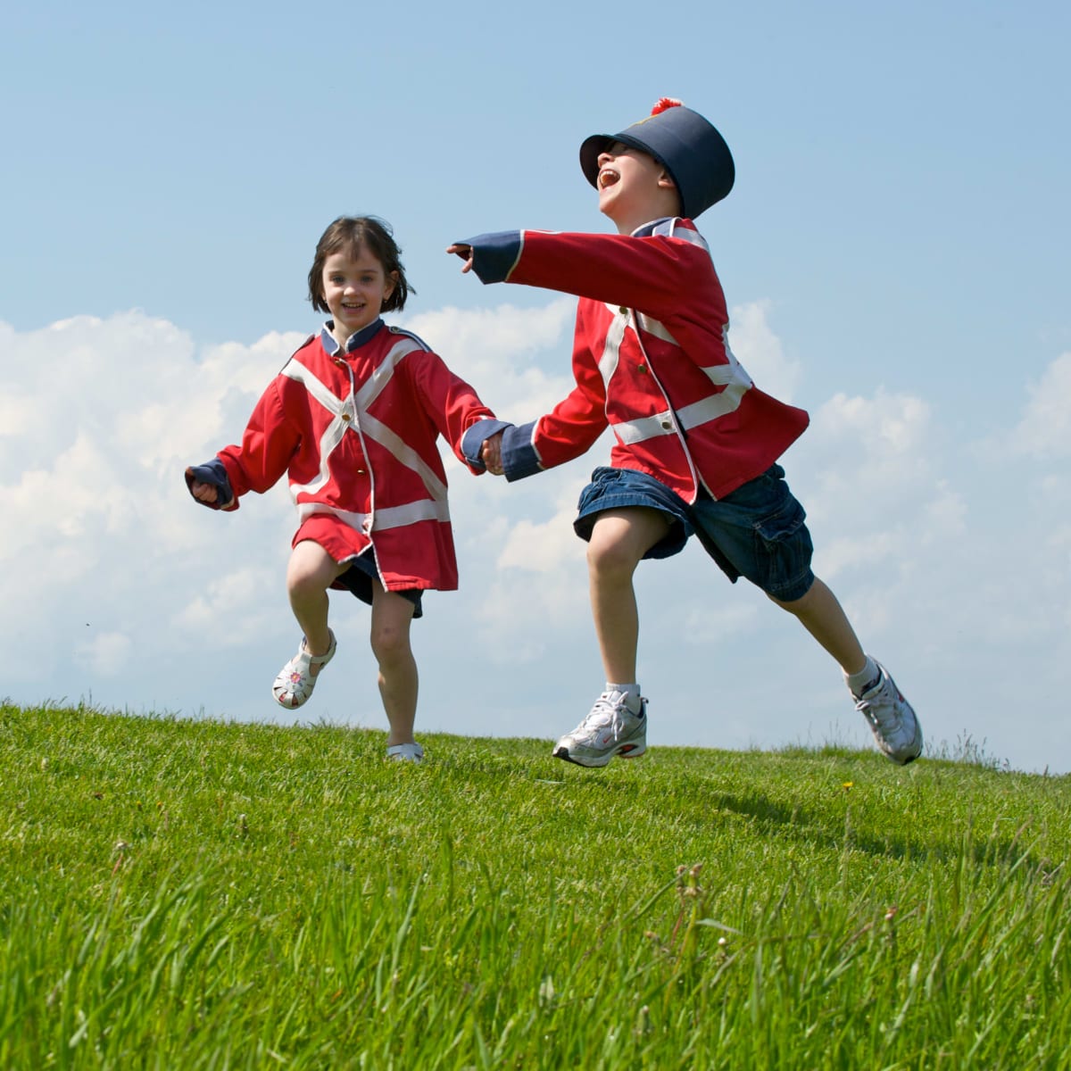 Children having fun dressed up as 19th-century militiamen.