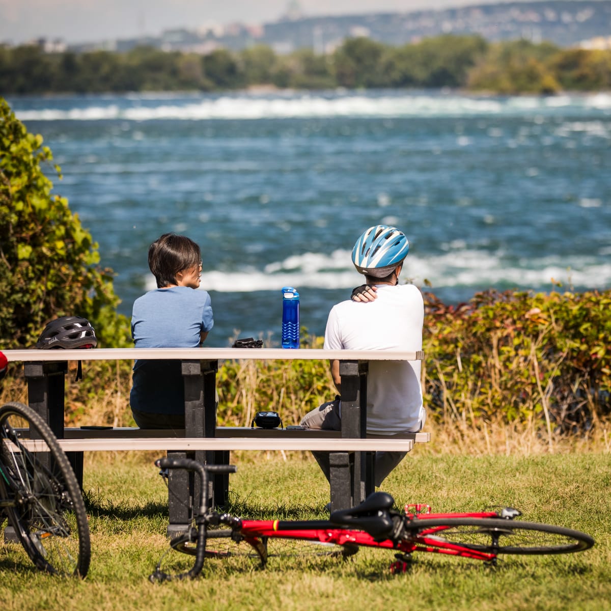 Two people and their bikes at RécréoParc.