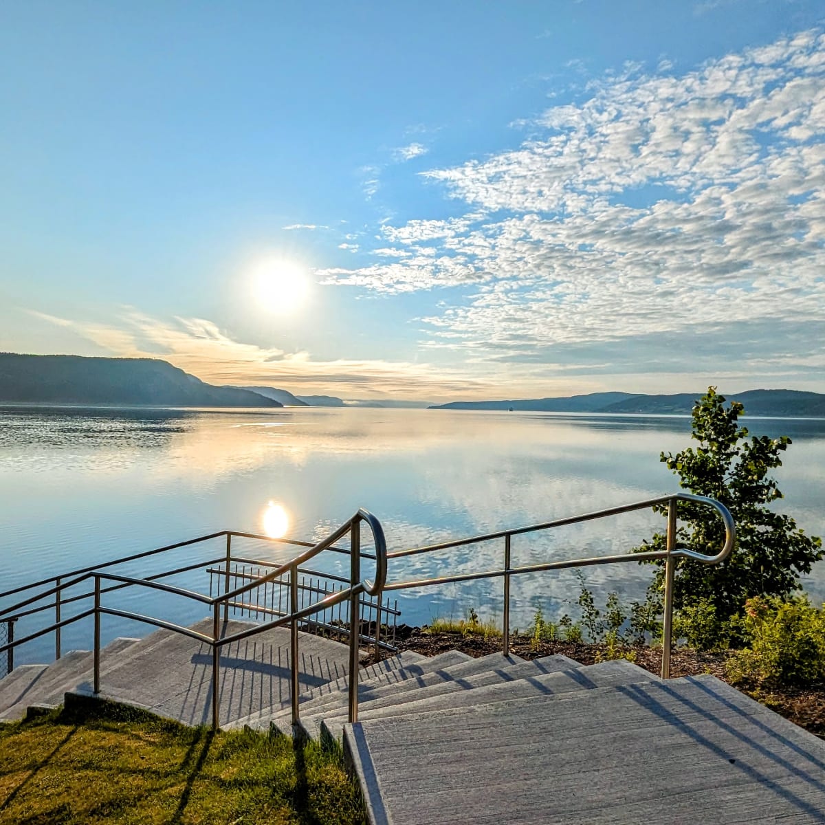 Stairs on a boardwalk along the banks of the Saguenay Fjord.