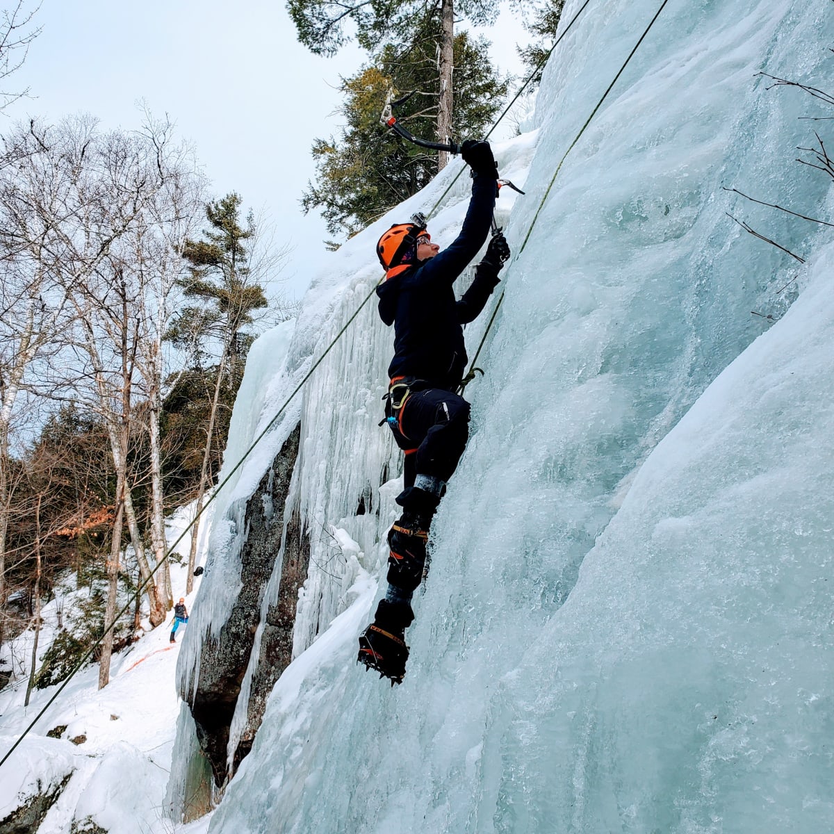 Climber on an icy cliff.