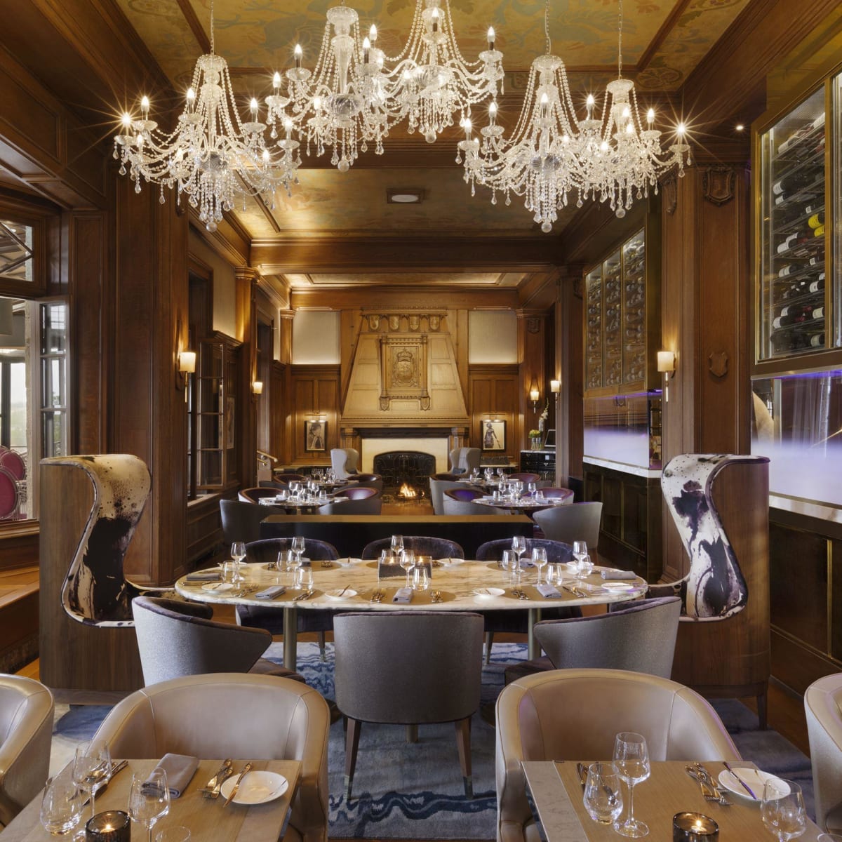 The dining room of the Champlain restaurant, featuring a large chandelier.