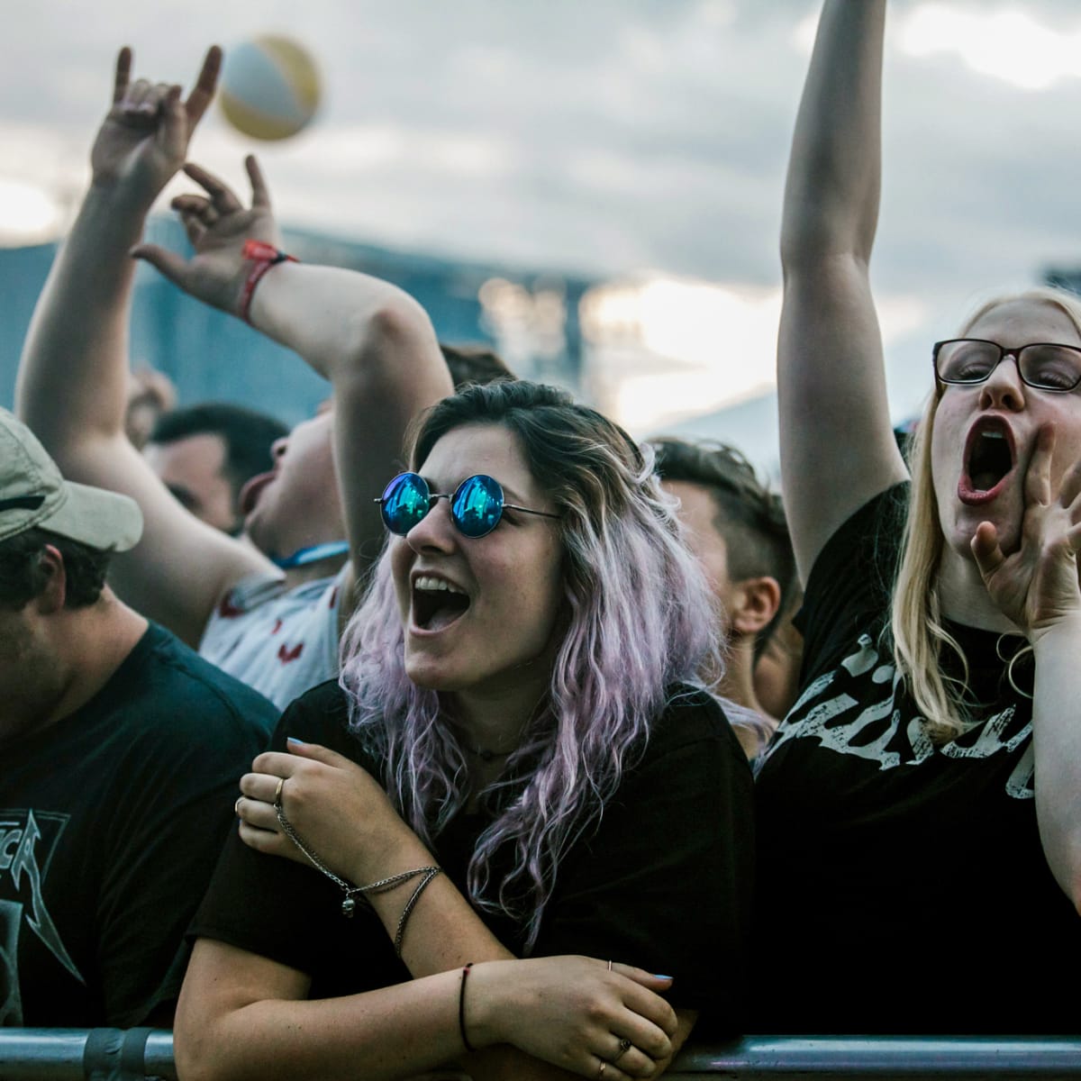 Smiling young woman in a festival crowd.