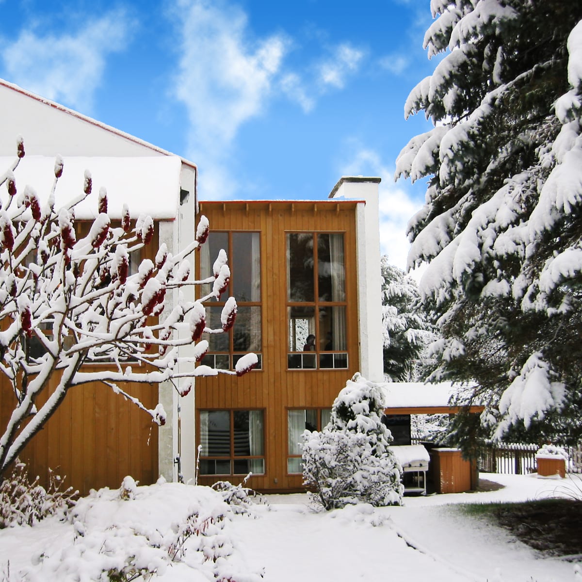 Exterior of Hotel Chéribourg under a blanket of snow