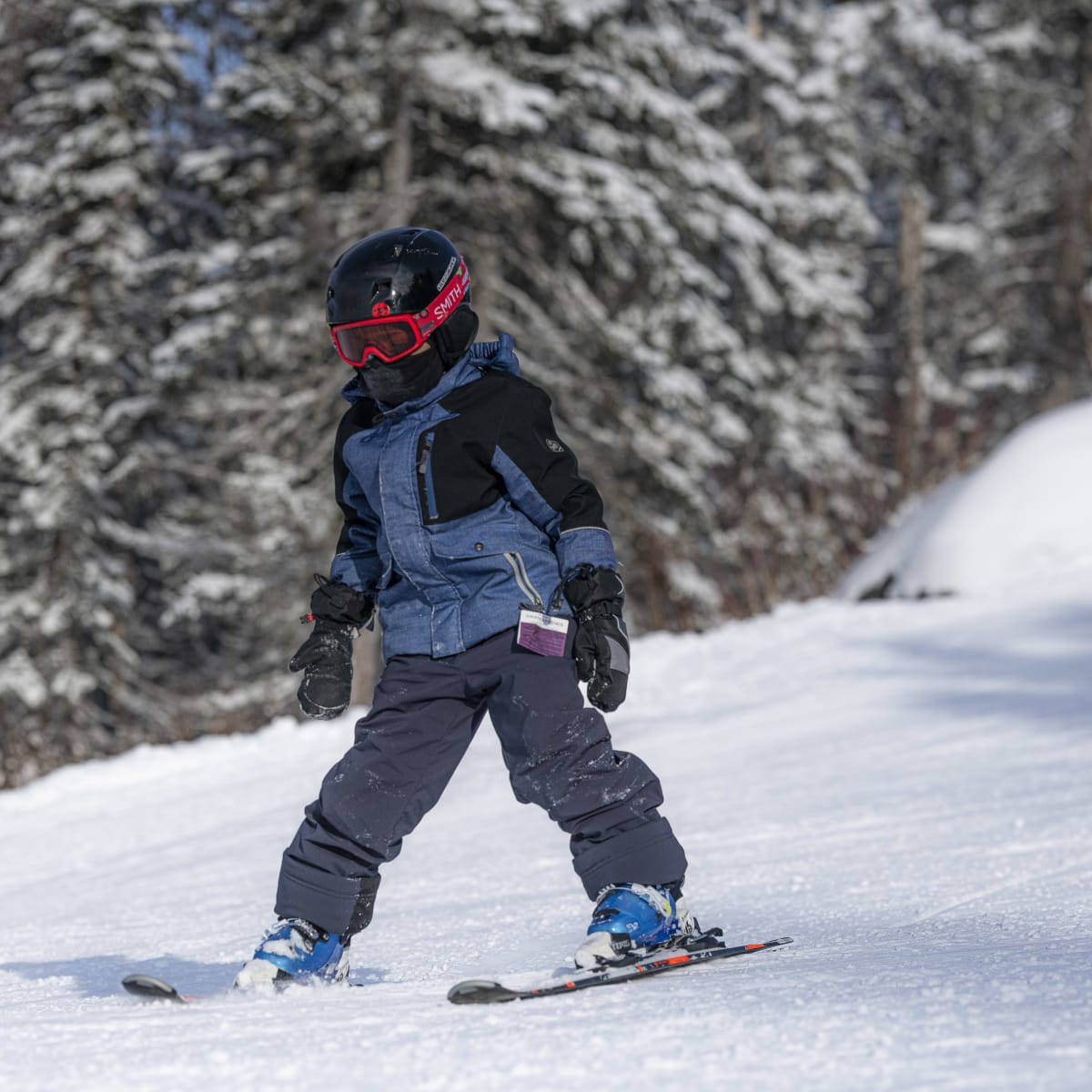Child learning to ski.