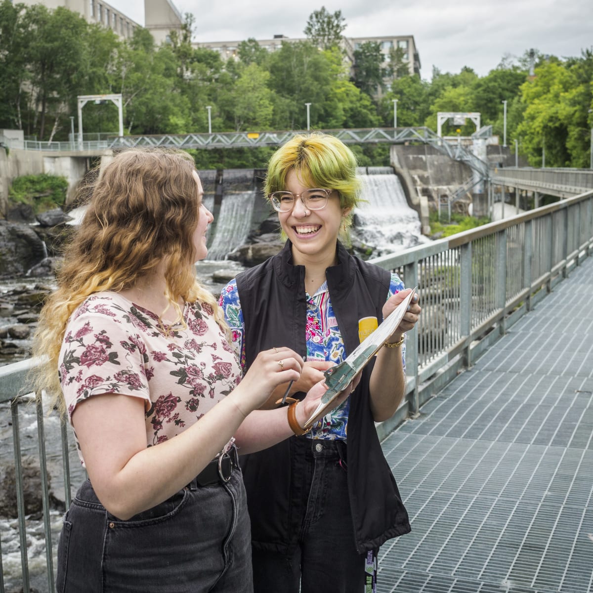 Two people participating in a creative workshop in nature.