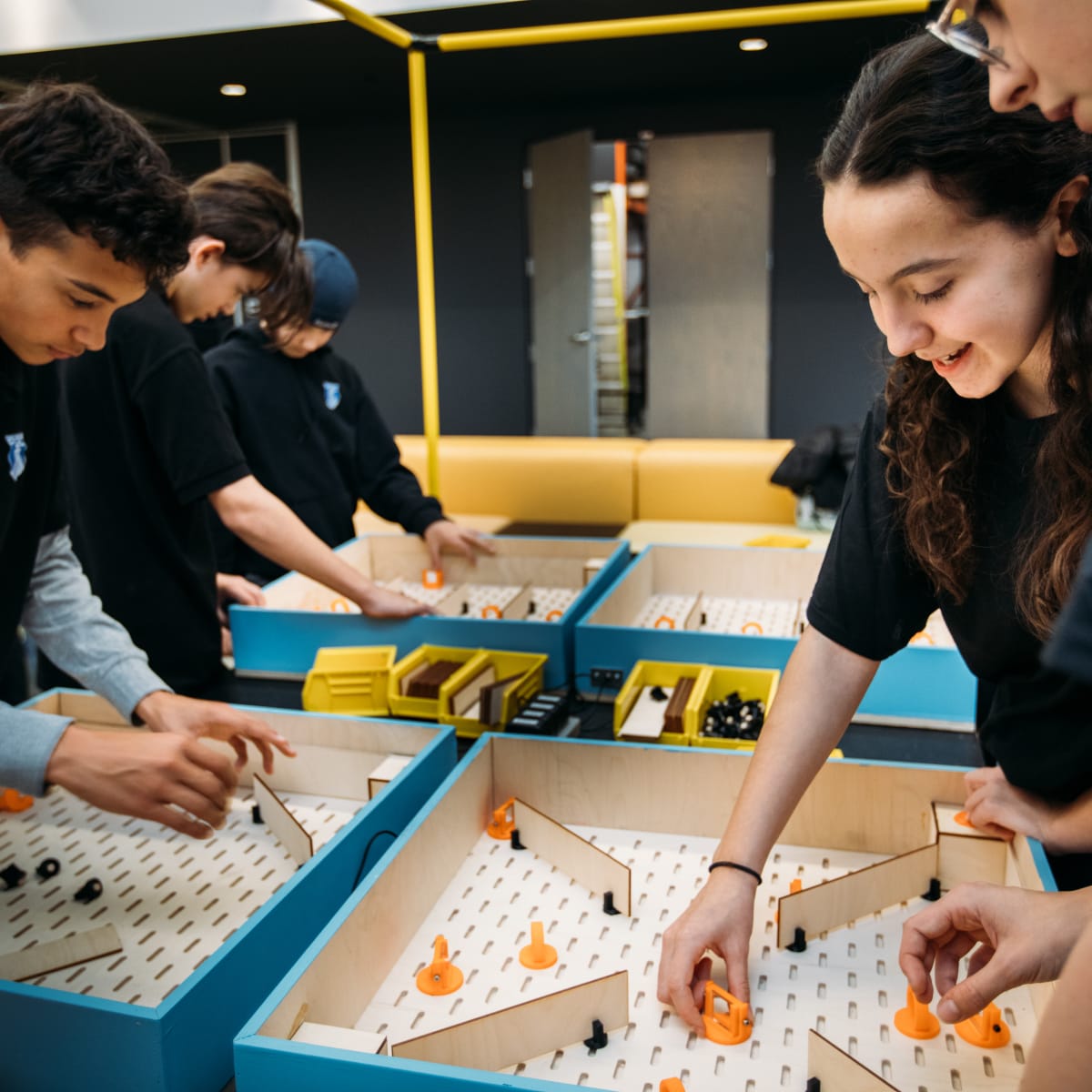Group of teens taking part in a scientific workshop