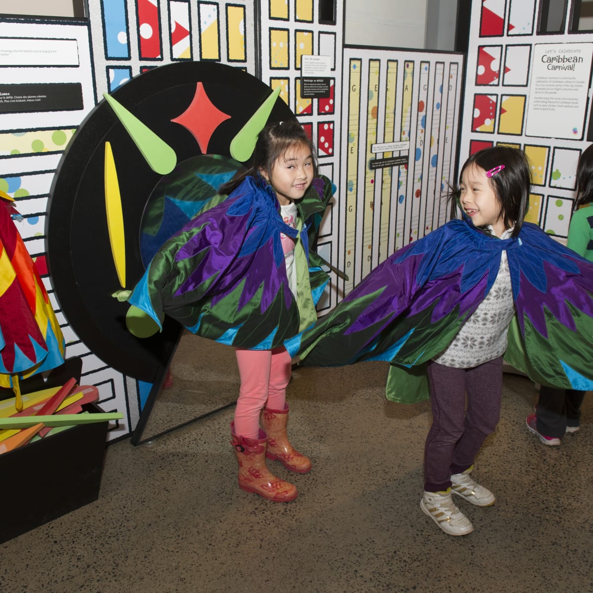 3 kids in costumes visiting the museum exhibit