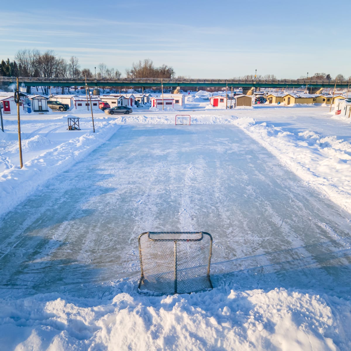 Ice fishing village and hockey rink.