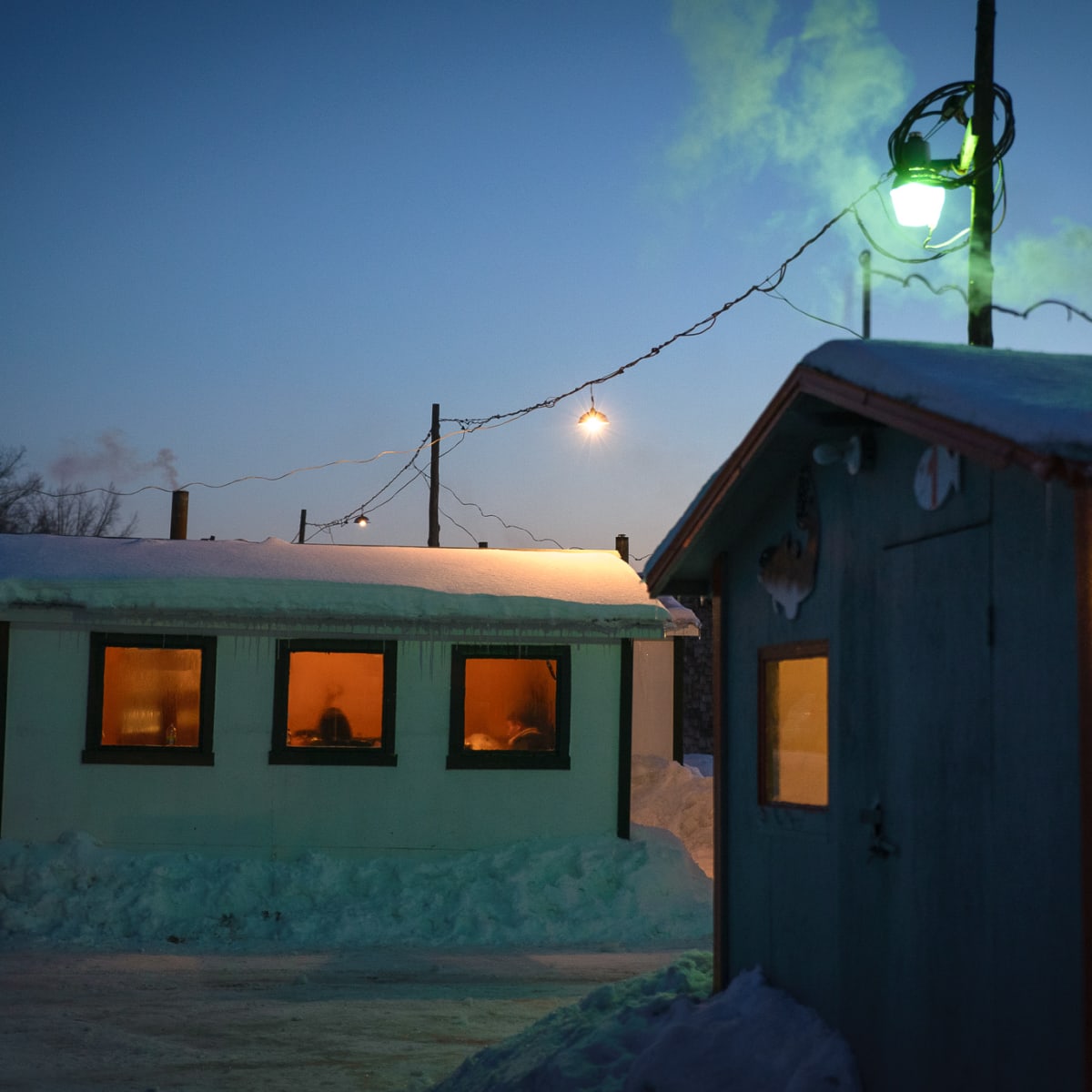 Peacefulness at the ice fishing village at dusk.