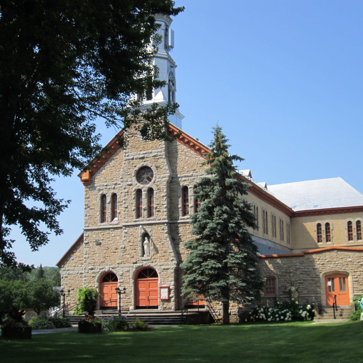 The Montebello church, surrounded by greenery.