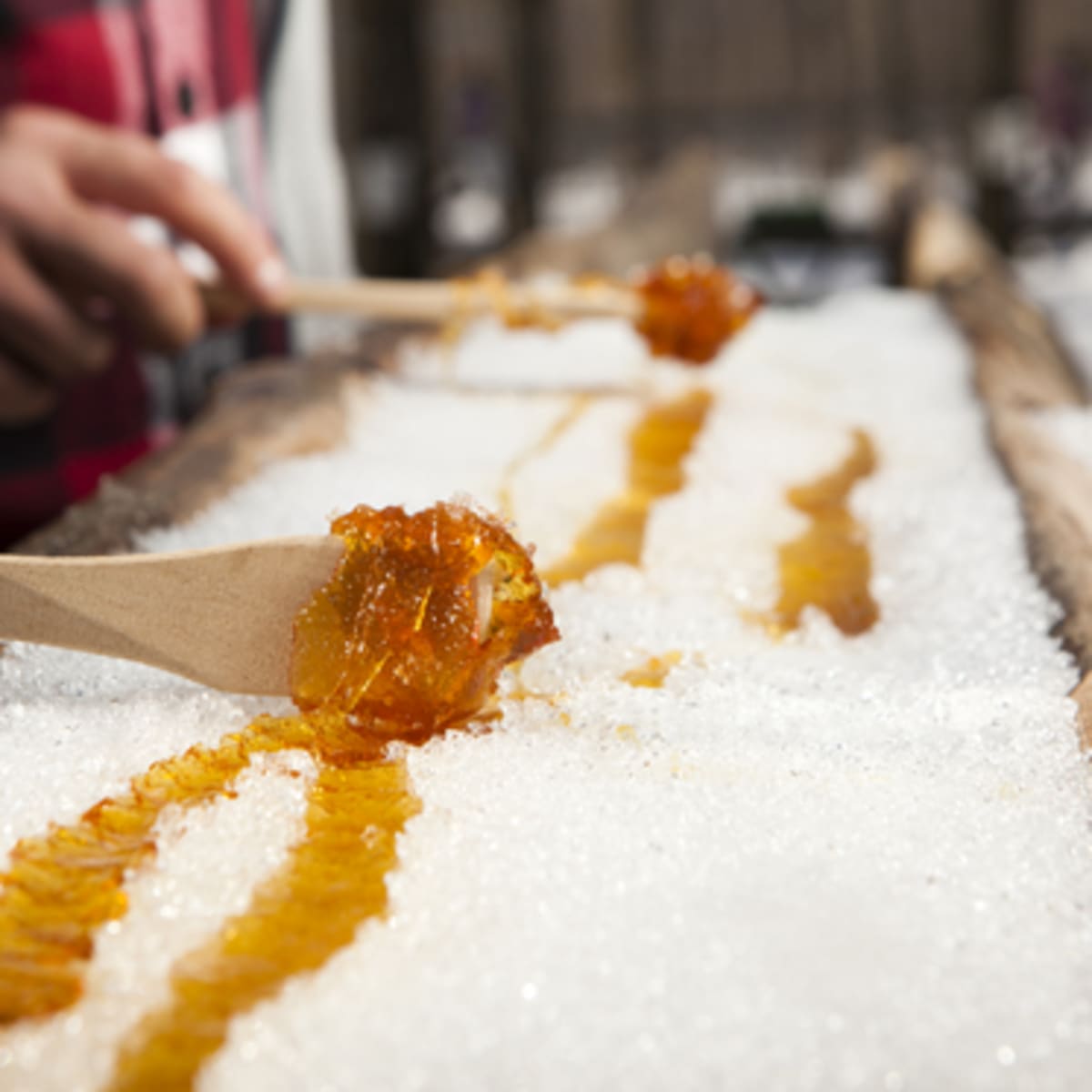 Maple taffy on snow at sucrerie des Gallant