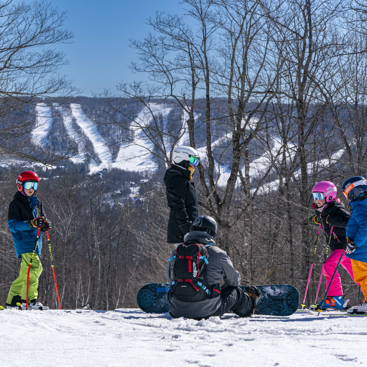 A family on a trail at Sommet Gabriel.
