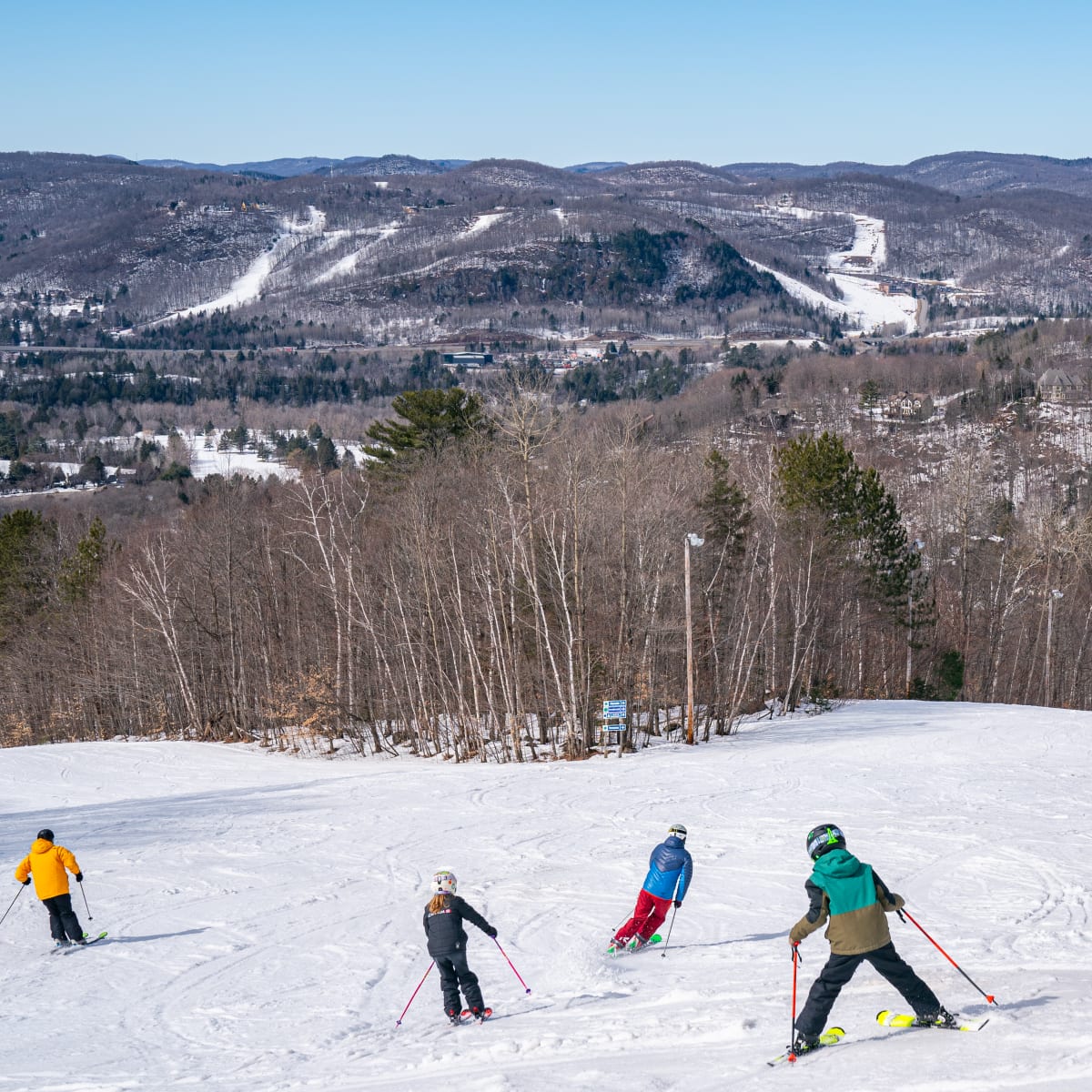 Skiers at Sommet Olympia.