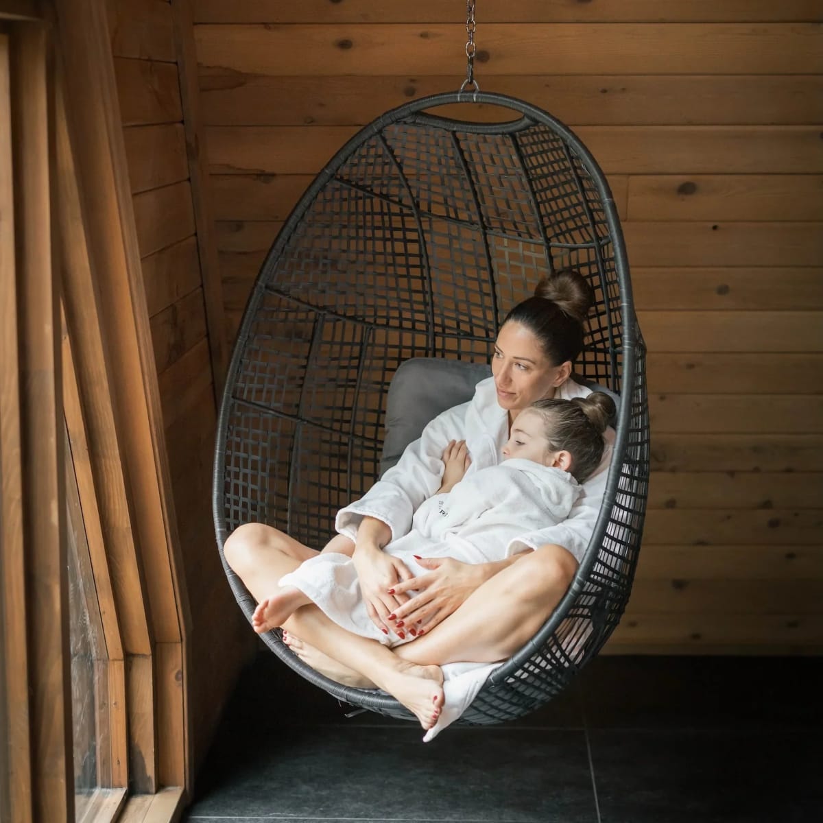 Mother and daughter in a suspended chair at the Siberia Spa.