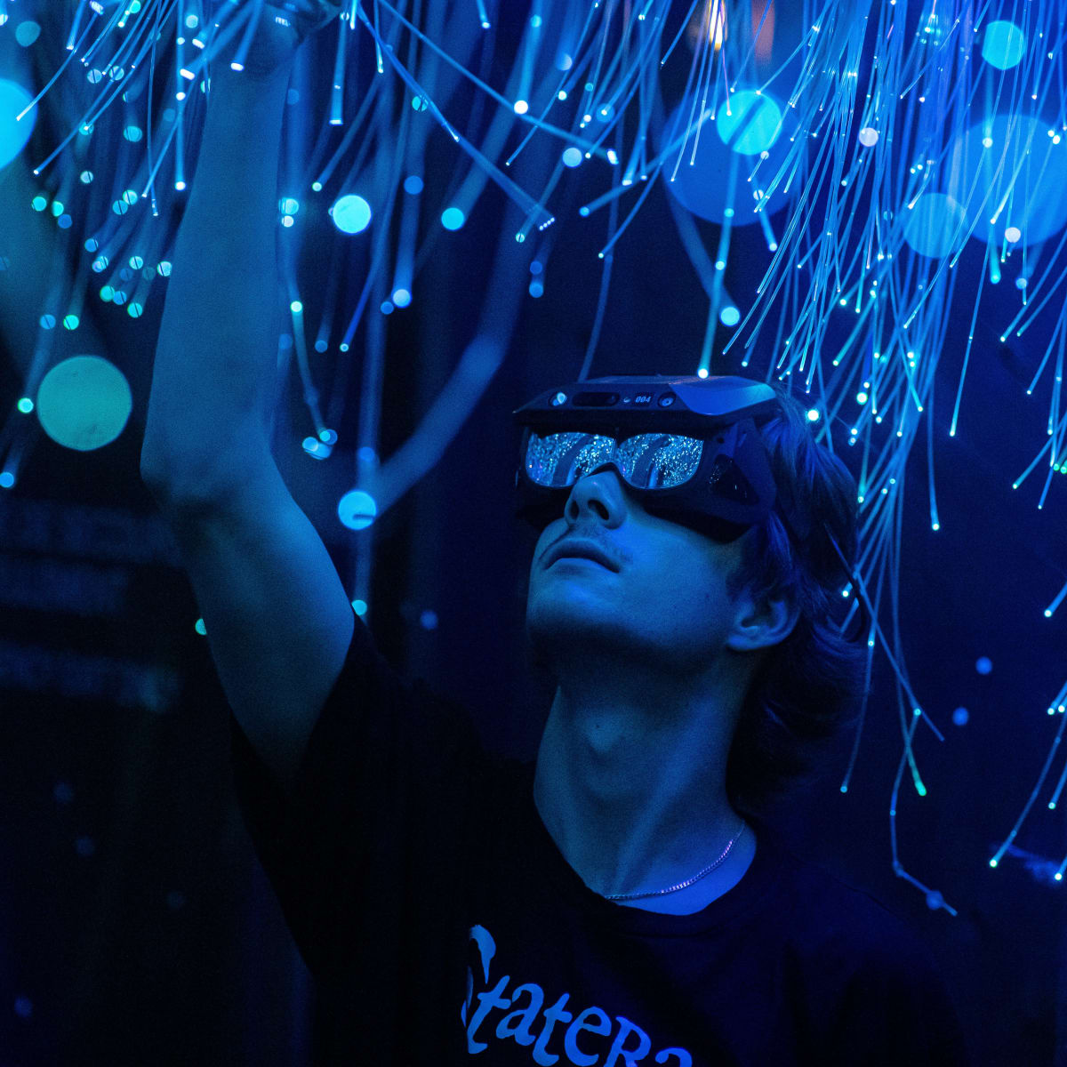 A person under a virtual projection in Statera—the fabulous archipelago.