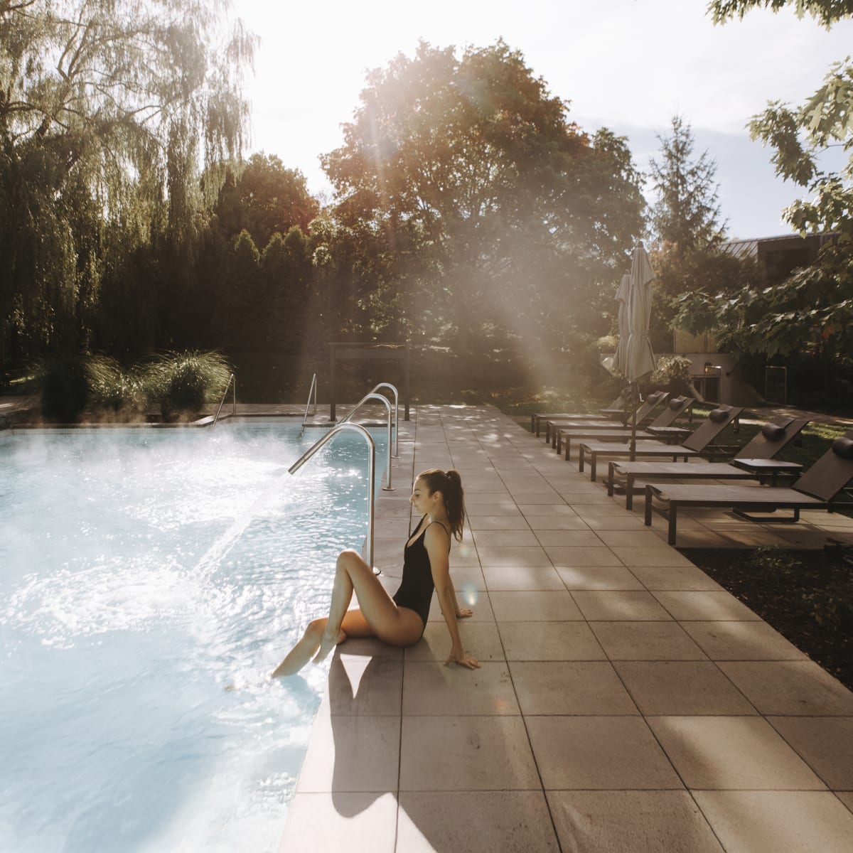 Woman beside the pool at Strom spa nordique Mont-Saint-Hilaire.