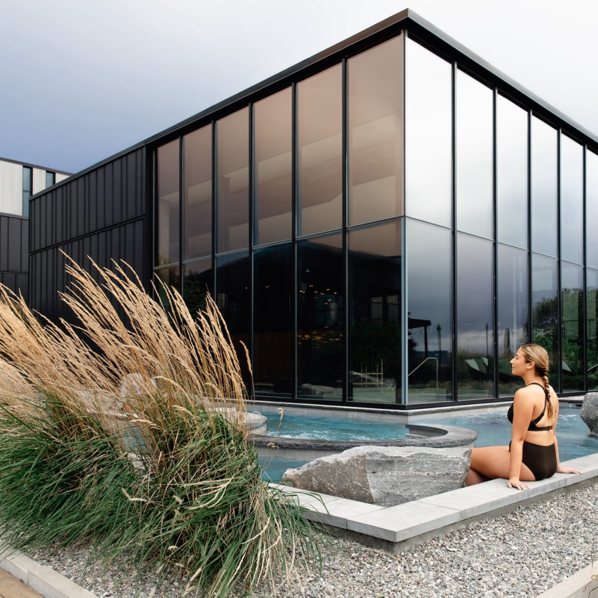 Woman by the pool at Strøm spa nordique Vieux-Québec.
