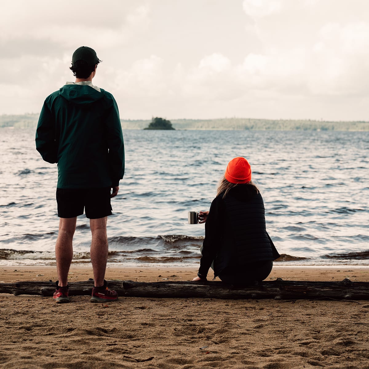 Couple at the edge of a lake.