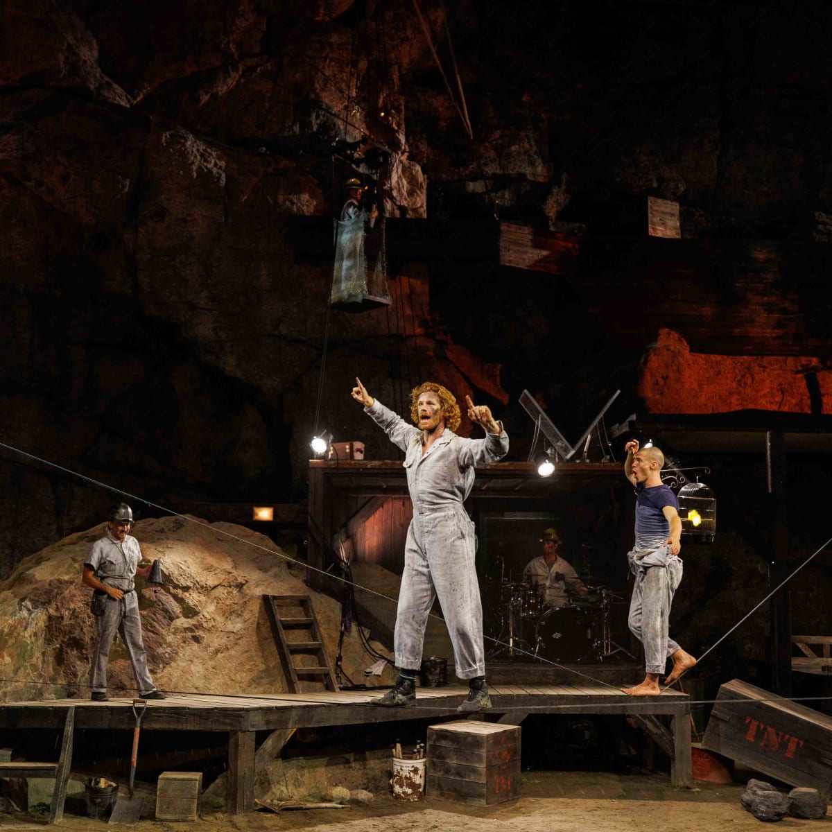 Circus performers on a stage.