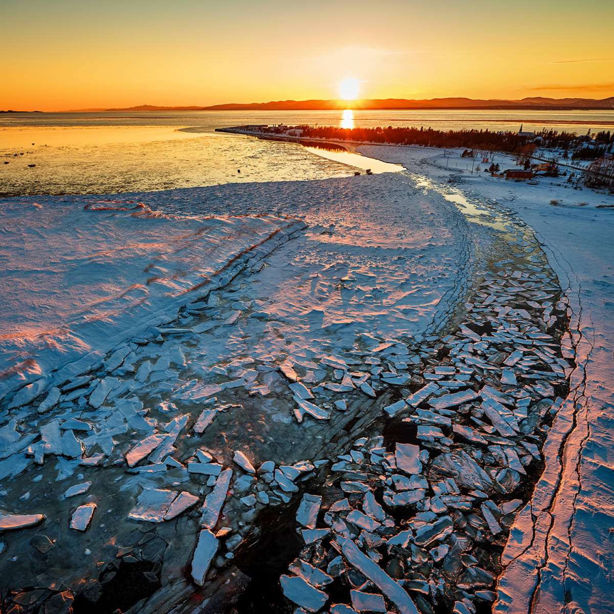 Winter sunset by the sea in the Lower St. Lawrence region.