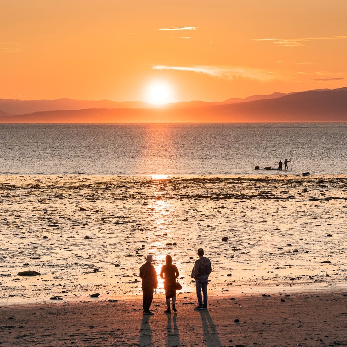 People watching the sunset in Kamouraska. 