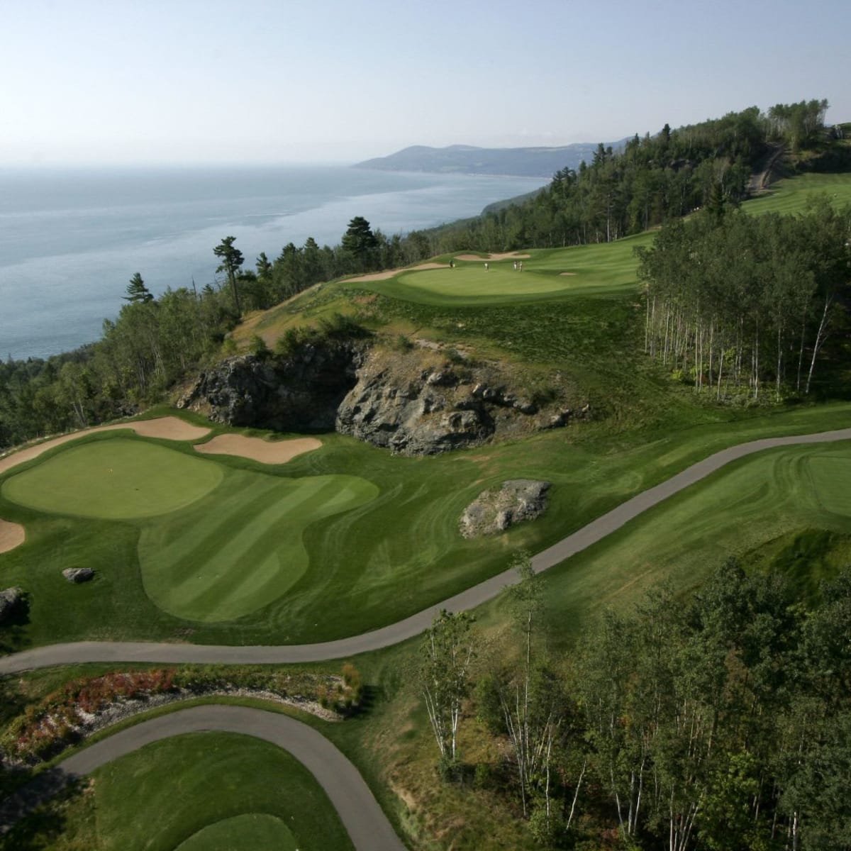 Aerial view of the Fairmont Le Manoir Richelieu Golf Club course along the St. Lawrence River.