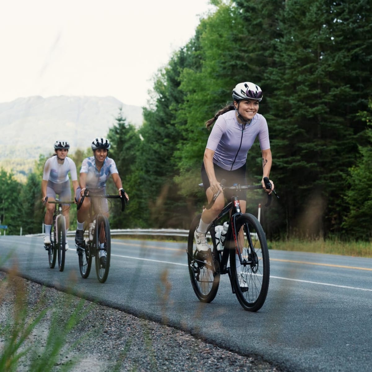 Cyclists along the side of the road.