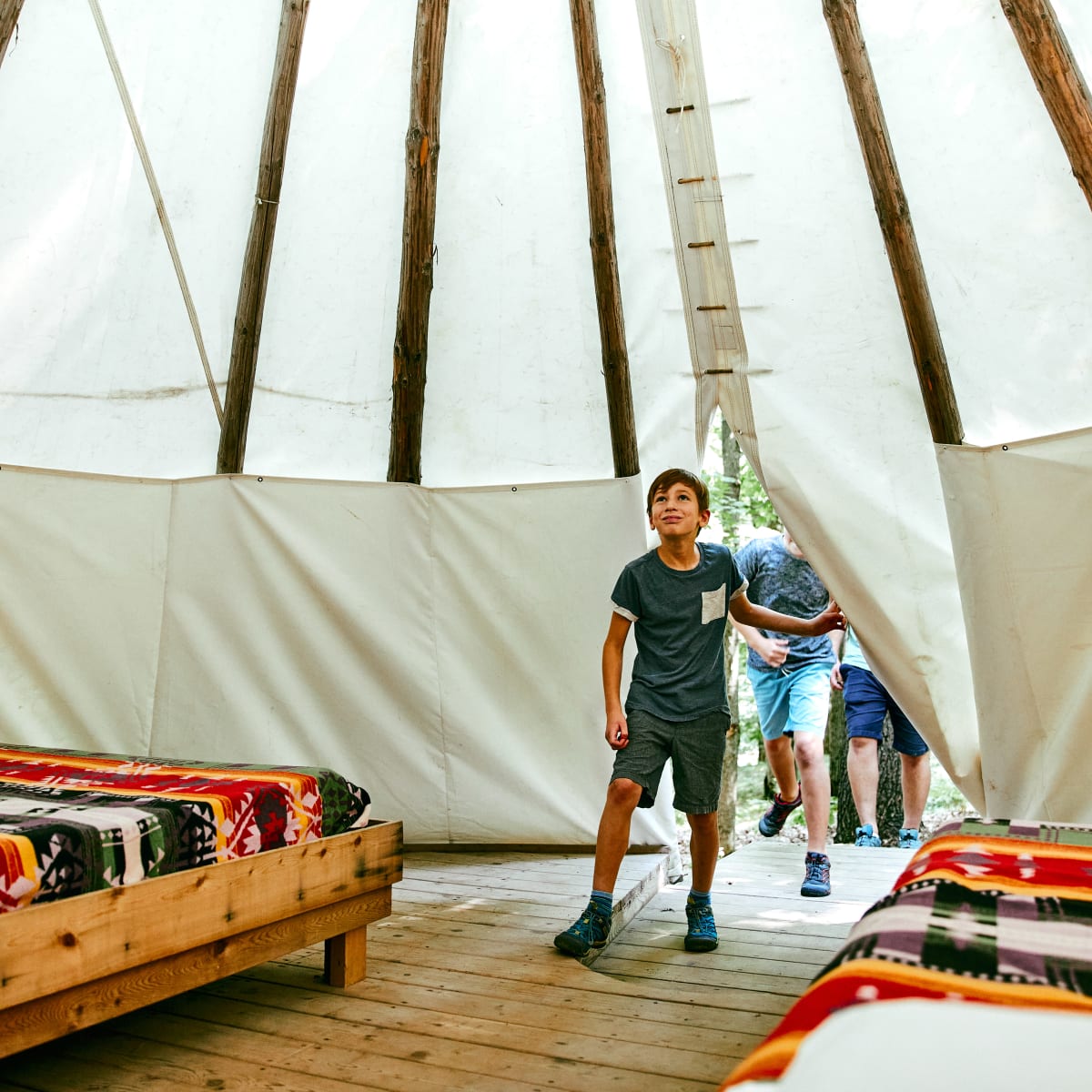Children in a teepee.
