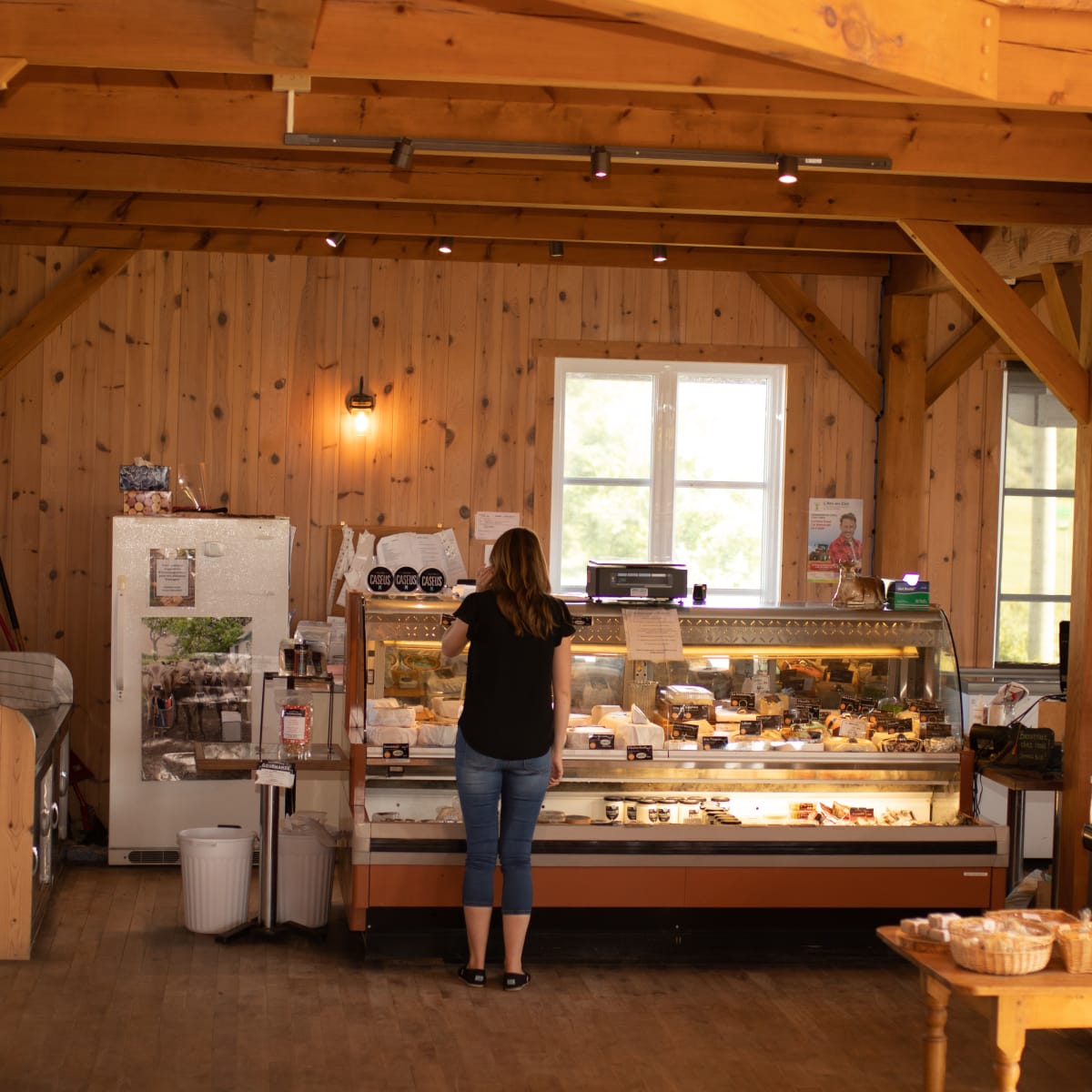 Woman at the counter at Fromagerie des Grondines.