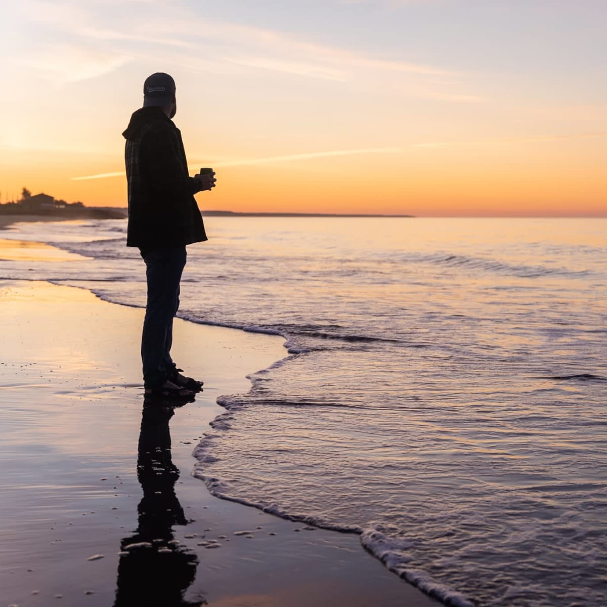 Man at sunrise at the beach.
