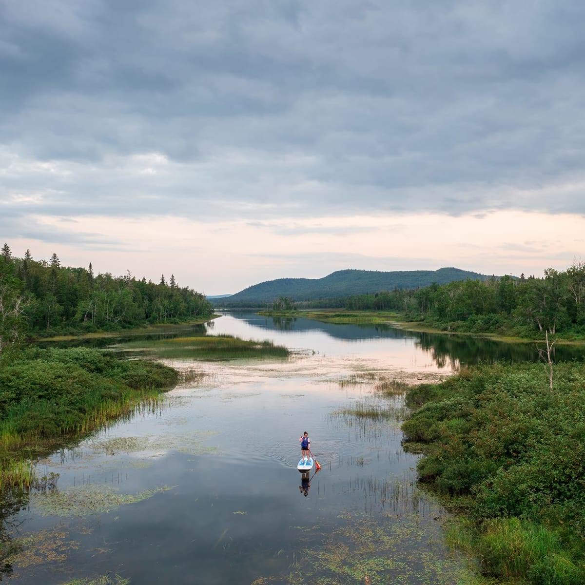 Stand-up paddleboarding at Lac-Témiscouata National Park.