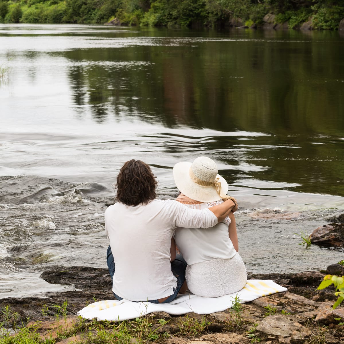 Couple by a river.