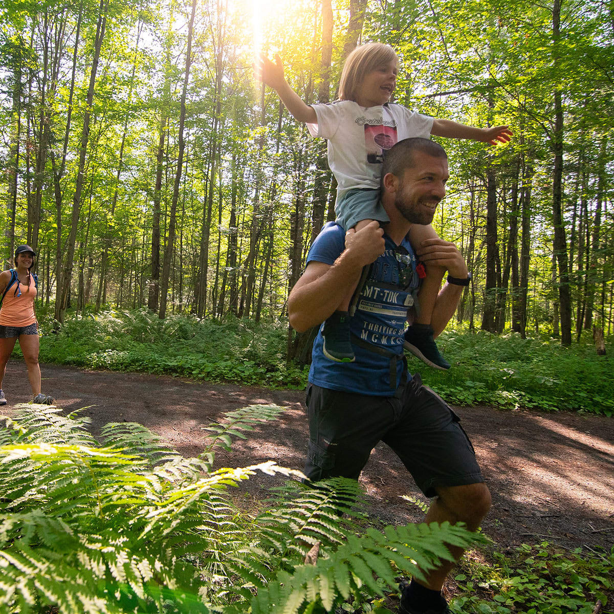 Family in a forest in the Vallée Saint-Sauveur.