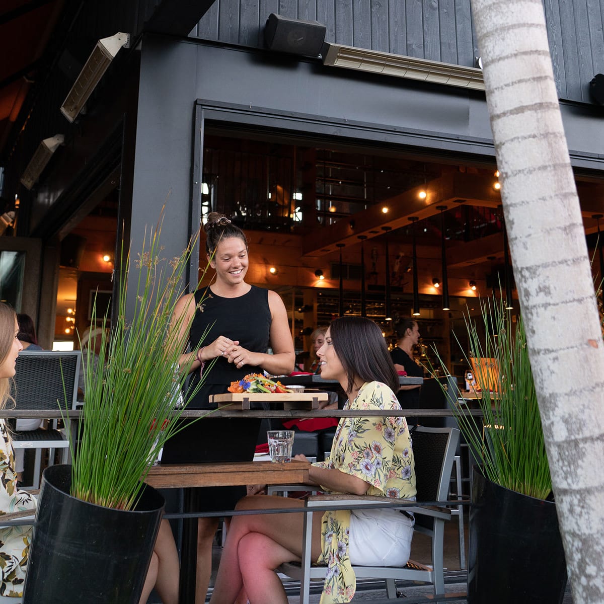 People on the terrace at Vallée Saint-Sauveur.
