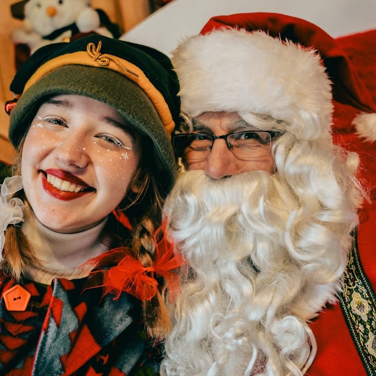 Santa Claus and an elf at the Village de Noël - Sapins Goupil.