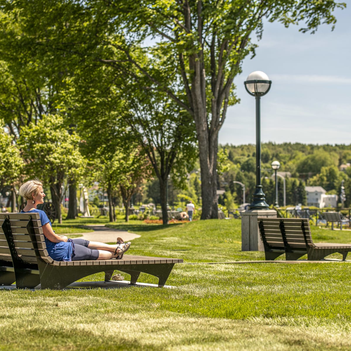 A woman relaxing in a park.