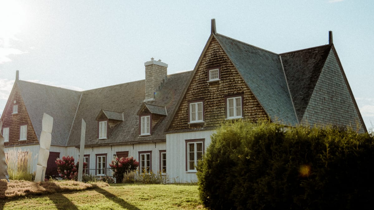 Well-maintained heritage home under a blue sky