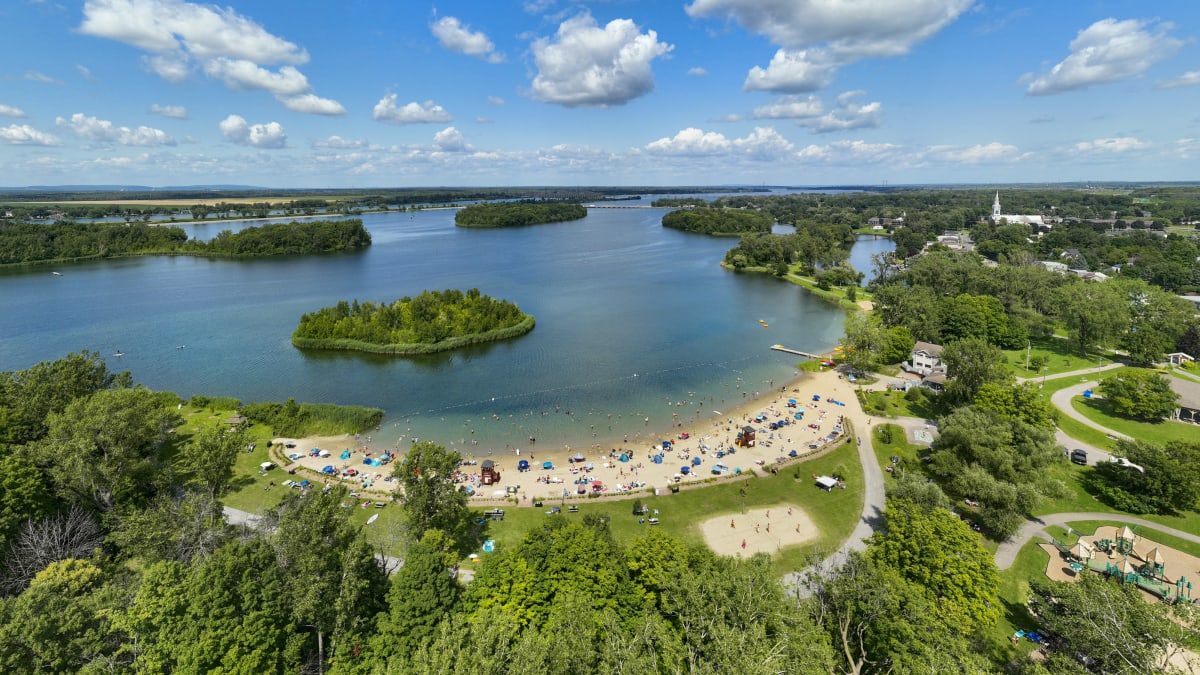 Aerial view of a beach lining shimmering blue waters