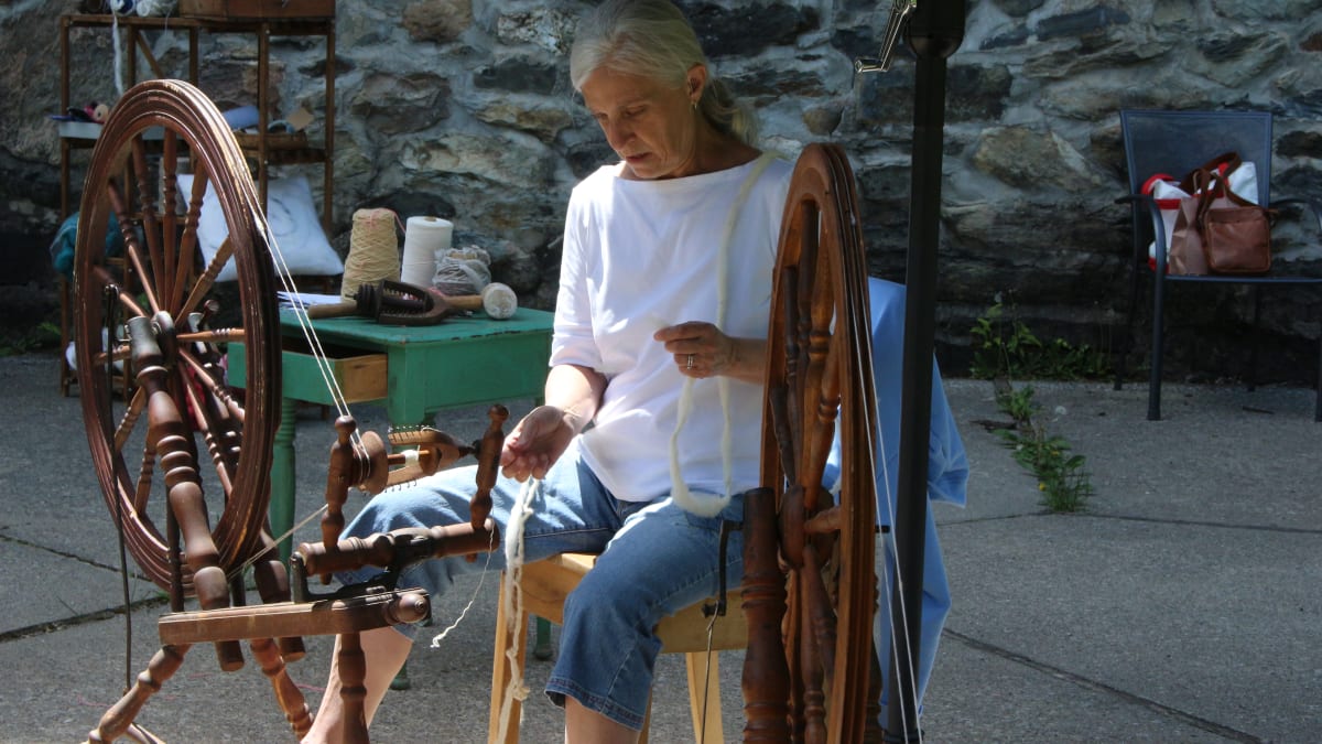 Woman operating a spinning machine