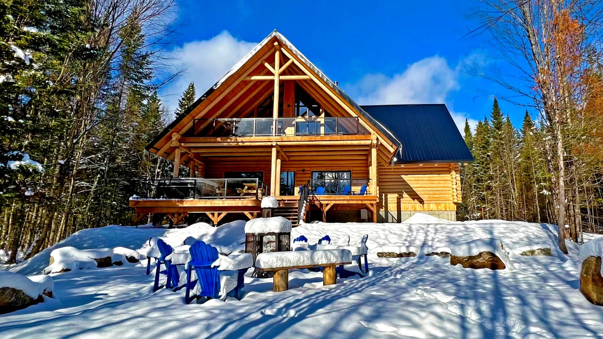Front of a two-storey log cabin