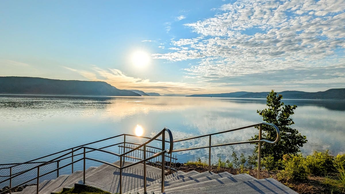 Stairs on a boardwalk along the banks of the Saguenay Fjord.