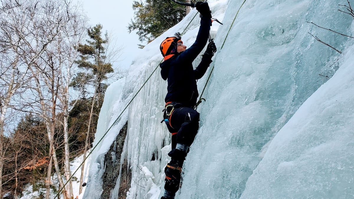 Climber on an icy cliff.