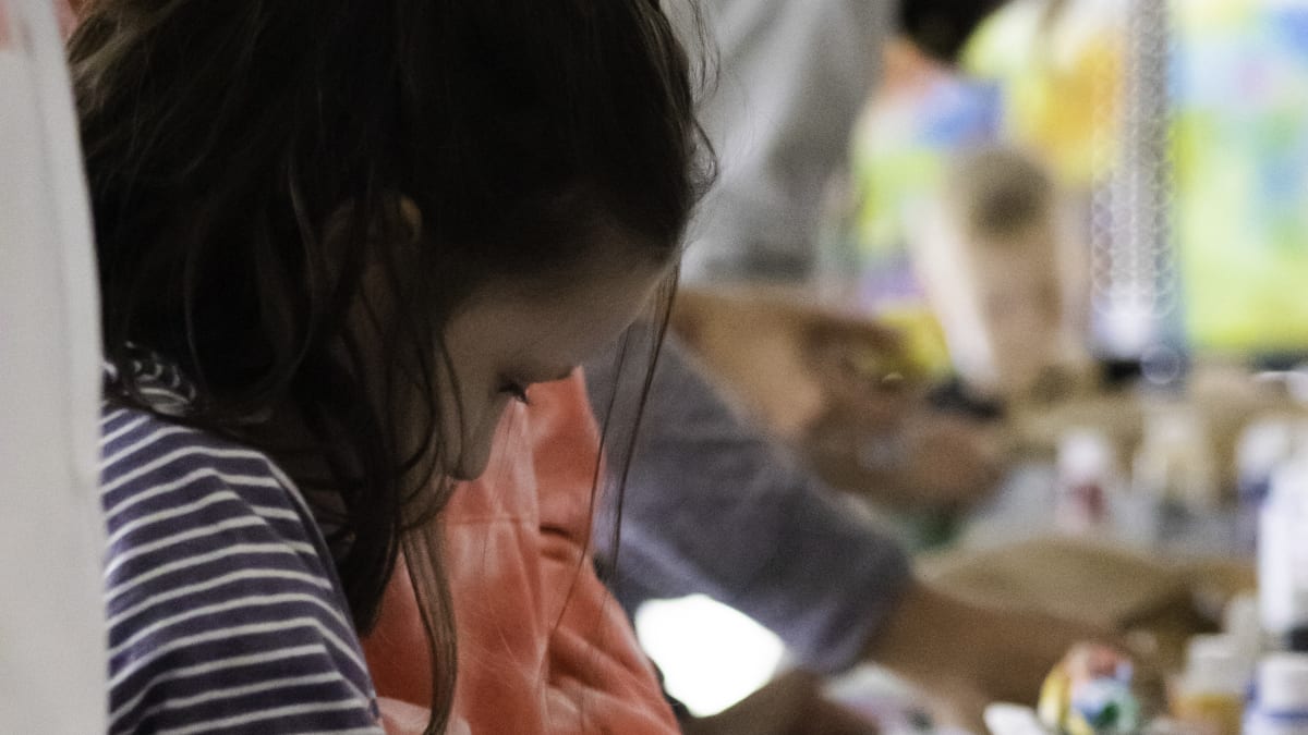 Young girl taking part in an art workshop