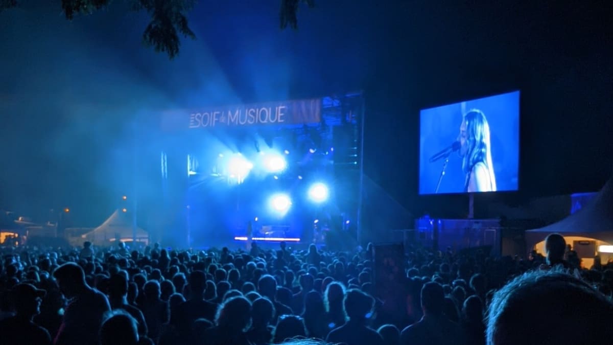 Evening crowds in bluish light.