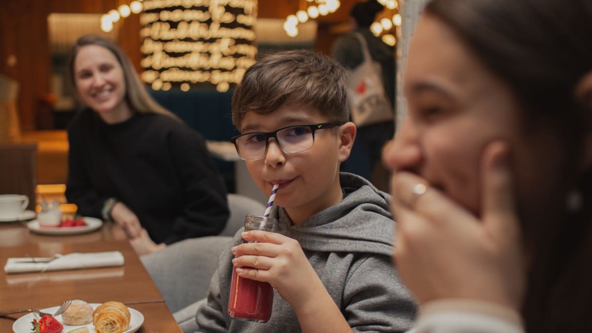 Kids having supper in a restaurant.